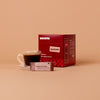 Mug of Brissta Americano with packaging in background on a beige background